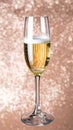 Close Up Champagne Glass with Bubbles and Gold Glittering Background Royalty Free Stock Photo