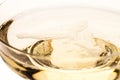 Close up of a champagne glass from the side with foam Royalty Free Stock Photo
