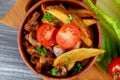 A close up champignon mushrooms with oven baked potato and tomato Royalty Free Stock Photo