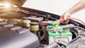 Close up Charging car battery with electricity through jumper cables Royalty Free Stock Photo