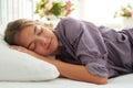 Close-up of charming young woman dreaming in her bed in sunlit b Royalty Free Stock Photo