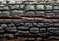 Close-up of charred wood, featuring a rough, cracked surface with a blackened texture. The burnt Royalty Free Stock Photo