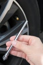 Close Up Of Checking Car Tyre Pressure Using Gauge Royalty Free Stock Photo