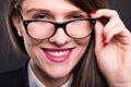 Close-up of cheerful girl manager with glasses