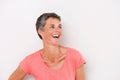 Close up cheerful middle age woman abasing white background