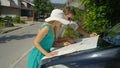 CLOSE UP: Cheerful young couple planning their summer road trip vacation on map Royalty Free Stock Photo