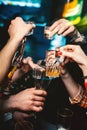 Close-up cheers clinking of friends with glasses in hands Royalty Free Stock Photo