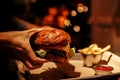 Close Up Cheese Burger And French Fries in garland background. Royalty Free Stock Photo