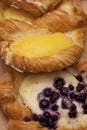 Close up of cheese danish puff pastry with blackberries and vanilla custard