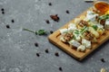 Close-up of a cheese plate. 4 types of cheese, soft white brie cheese, camembert, semi-soft briques, blue, roquefort, hard cheese Royalty Free Stock Photo