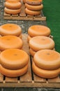 Close-up of cheeses stacks for sale at the Market Square fair in Gouda.