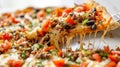 Close-up of a cheesy taco pizza slice with toppings being lifted Royalty Free Stock Photo