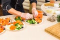 Close-up of chef cooking food kitchen restaurant cutting cook hands hotel man male knife preparation fresh preparing Royalty Free Stock Photo