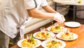 Close-up of chef cooking food kitchen restaurant cutting cook hands hotel man male knife preparation fresh preparing Royalty Free Stock Photo