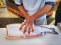 Chef Filleting Salmon on Table at Japanese Restaurant Royalty Free Stock Photo