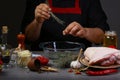 Close up of a chef hands preparing with caramel beer sauce and herbs. Oktoberfest menu. The concept of Bavarian cooking recipe