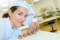 close up chef proudly arranging sweets