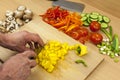 Close up of a chefs hands dicing a yellow bell pepper Royalty Free Stock Photo