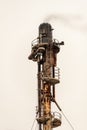 Close up of a Chemical plant exhaust stack with smoke coming out Royalty Free Stock Photo