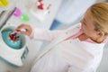 Close up of chemist putting test tube in device