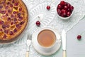 Close up of cherry pie on a plate with a bowl of cherries Royalty Free Stock Photo