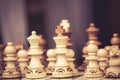 Close up of chessboard with wooden pieces on table in sunlight. Chess game, close up image with selective focus Royalty Free Stock Photo