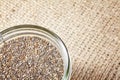 Close up of Chia seeds in a jar on linen background. Royalty Free Stock Photo