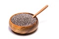 Close up of chia seeds Salvia hispanica and wooden spoon in a round wooden bowl on isolated background. Royalty Free Stock Photo