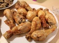 Close-up of the chicken drumsticks in the dish.