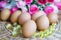 Close up chicken eggs and rose in background Royalty Free Stock Photo