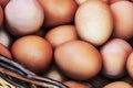 Close up chicken eggs in wicker basket Royalty Free Stock Photo