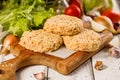 Close-up chicken hamburger cutlet breaded with paprika and garlic. Homemade minced poultry cutlet with spices. Fresh lettuce Royalty Free Stock Photo