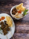 A close up of chicken porridge in a porridge bowl