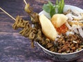 A close up of chicken porridge in a porridge bowl