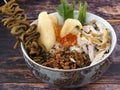 A close up of chicken porridge in a porridge bowl