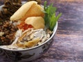 A close up of chicken porridge in a porridge bowl