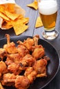 Close-up of chicken wings, nachos, beer Royalty Free Stock Photo