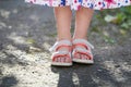 Close up of child girl feet wearing summer sandals shoes Royalty Free Stock Photo