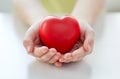 Close up of child hands holding red heart Royalty Free Stock Photo