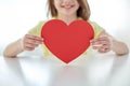 Close up of child hands holding red heart Royalty Free Stock Photo
