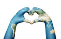 Close up of child hands, painted in the world map, formig heart shape Royalty Free Stock Photo