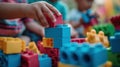 A close up of a child playing with colorful construction blocks, AI