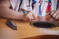 Close-up child playing guitar. Concept of liftstyle, learning, hobby, musician, dream and imagination. Royalty Free Stock Photo