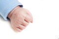 Close up of a child`s fist on white background. Clenched fist - hand of child, baby power. New born baby hand