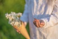 Close-up of a child`s hand with ladybug crawling over it and about to take off