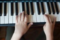 Close-up of a child`s hand playing the piano Royalty Free Stock Photo