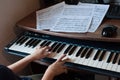 Close-up of a child`s hand playing the piano Royalty Free Stock Photo