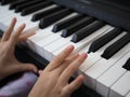 Close-up of a child's hand playing the piano . Favorite classical music. musical instruments for teaching music at Royalty Free Stock Photo