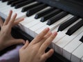 Close-up of a child& x27;s hand playing the piano . Favorite classical music. musical instruments for teaching music at Royalty Free Stock Photo