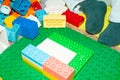 Close-up of a child`s hand. A 3 year old boy plays with multi-colored building blocks. children`s toys, construction Royalty Free Stock Photo